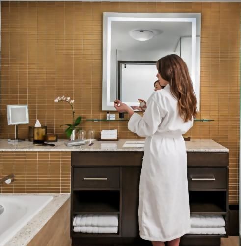 Pamper yourself throughout your stay with L'Occitane bath amenities while relaxing in plush robes and comfy slippers.