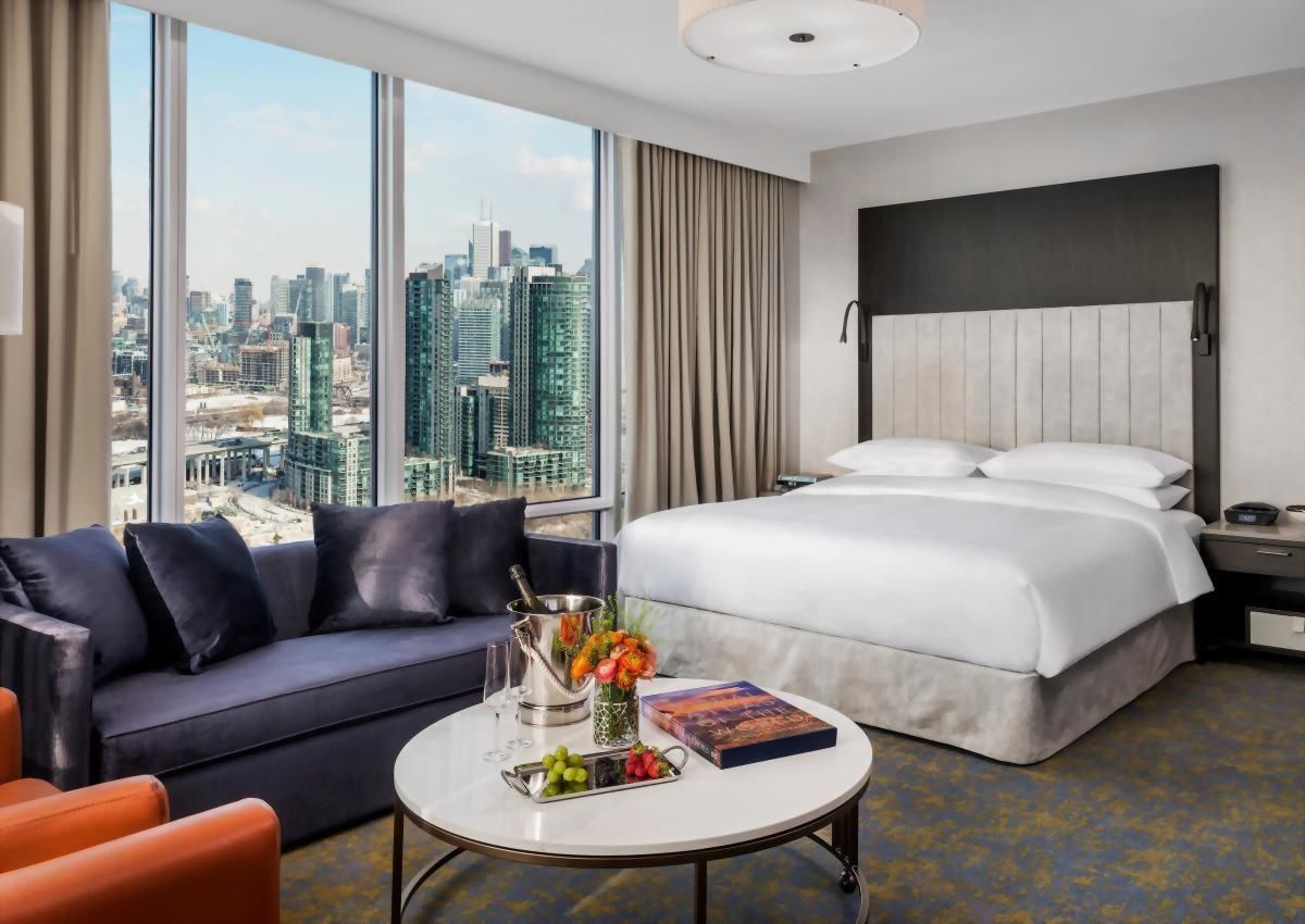 Approximately 440 square feet with a King size bed and sofa bed with stunning sunset or city views. This guestroom also features a work space illuminated by plenty of natural light.
