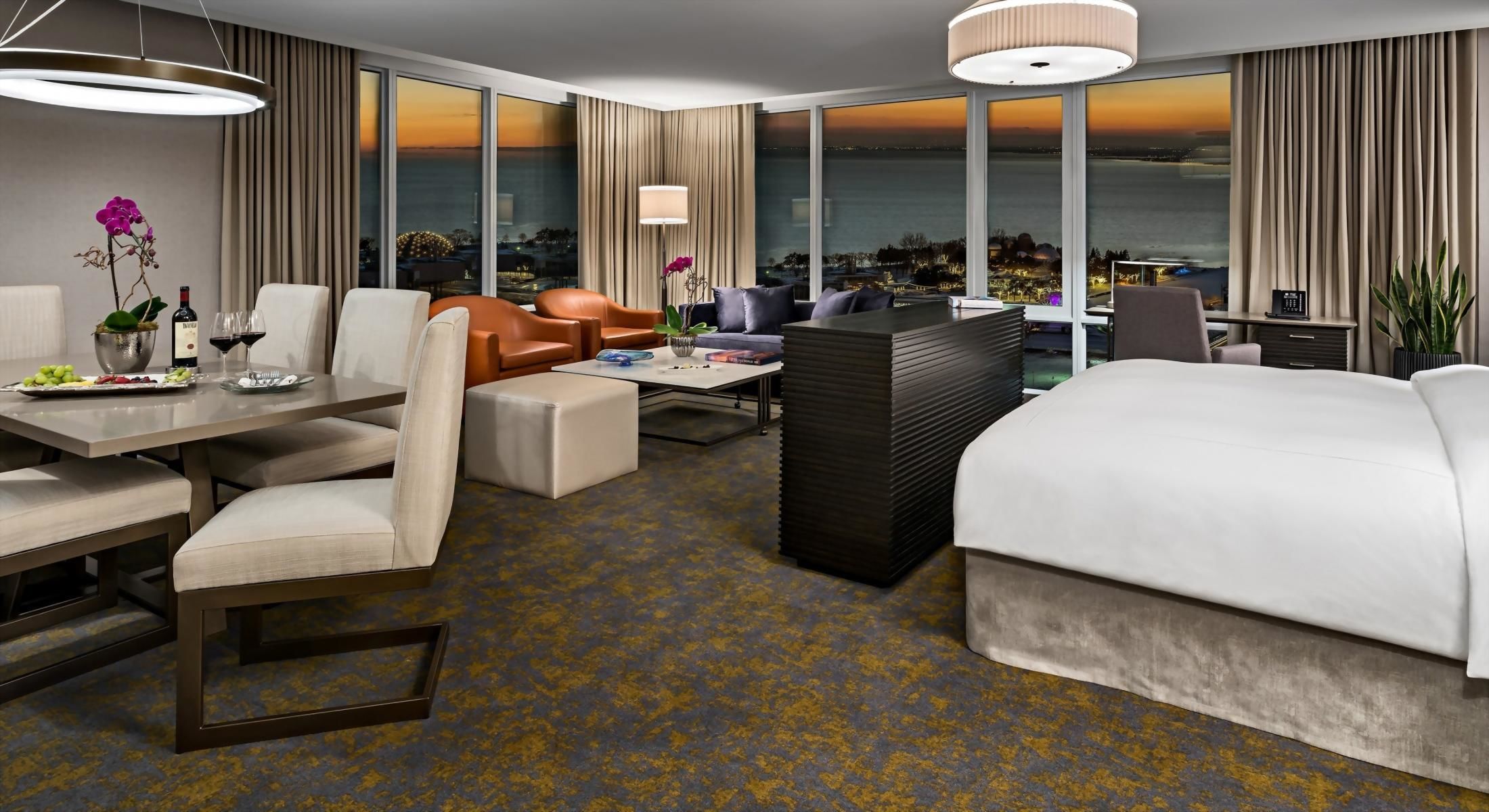 The Junior Suite is up to 860 sq feet featuring a king bed, living room area, and dining area.