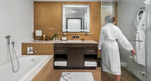 Pamper yourself in the large bathroom with a glass encased shower and stand alone bathtub.