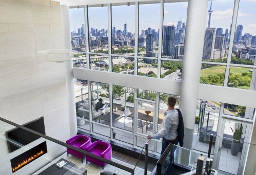 Enjoy floor to ceiling windows showcasing stunning views  in our Bi-Level Penthouse Suite.
