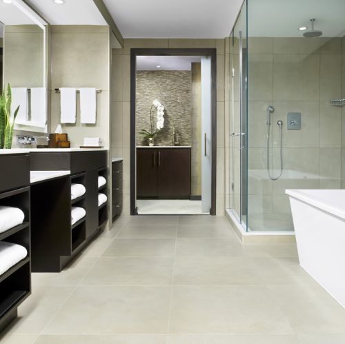 Royal King Bathroom featuring a stand alone tub and glass enclosed shower.