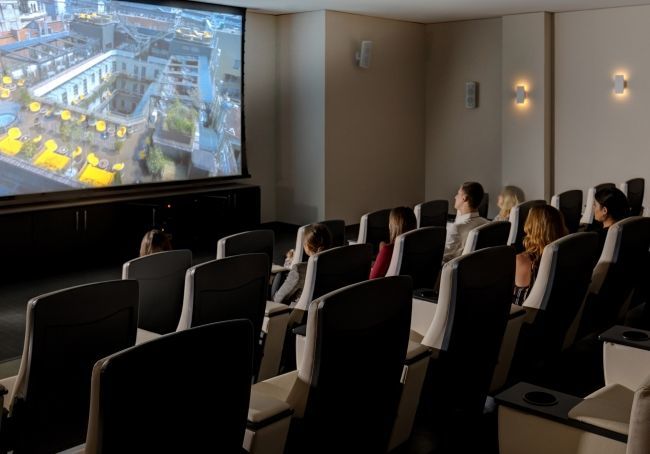 Guests enjoying a screening in our 2-level Cinema with 250 stadium-style seats.